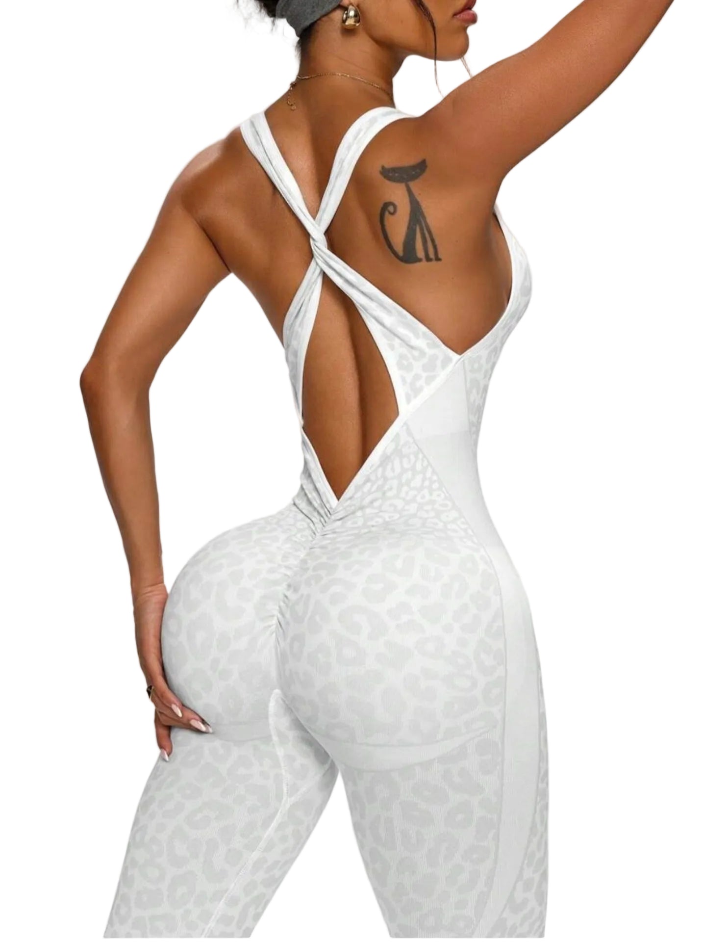 Person wearing a white textured jumpsuit with a plain background