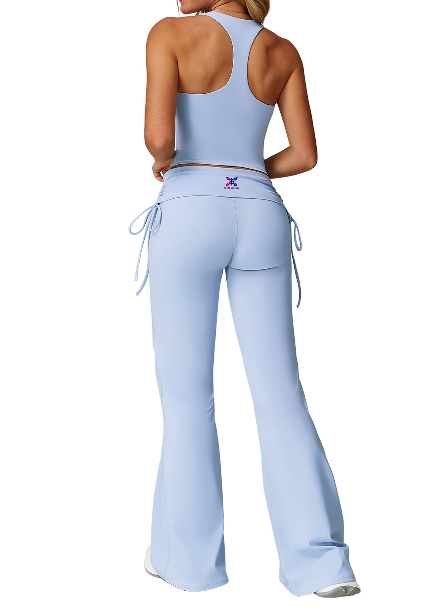 Light blue athletic outfit with drawstring pants on a plain background