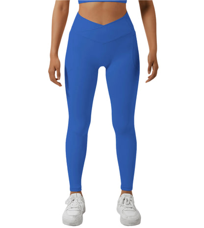 Person wearing blue leggings on a white background