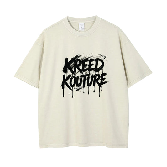 Beige t-shirt with 'Kreed Kouture' graphic design on a white background