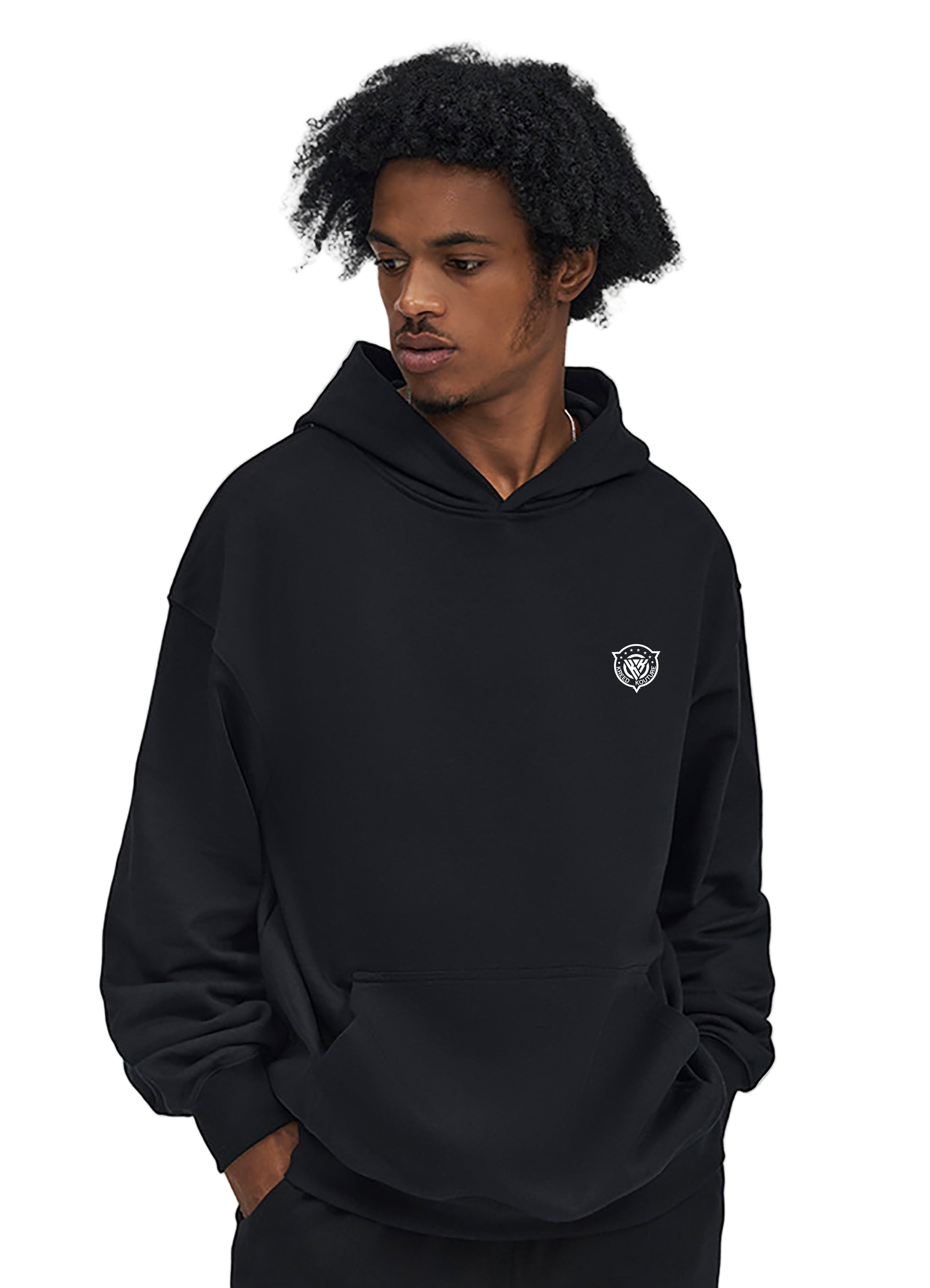 Person wearing a black hoodie with a small logo on a white background