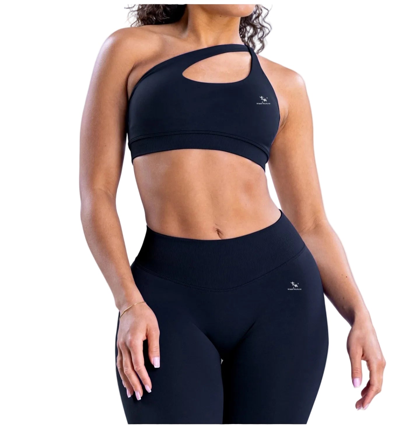 Person wearing a black sports bra and leggings on a light blue background
