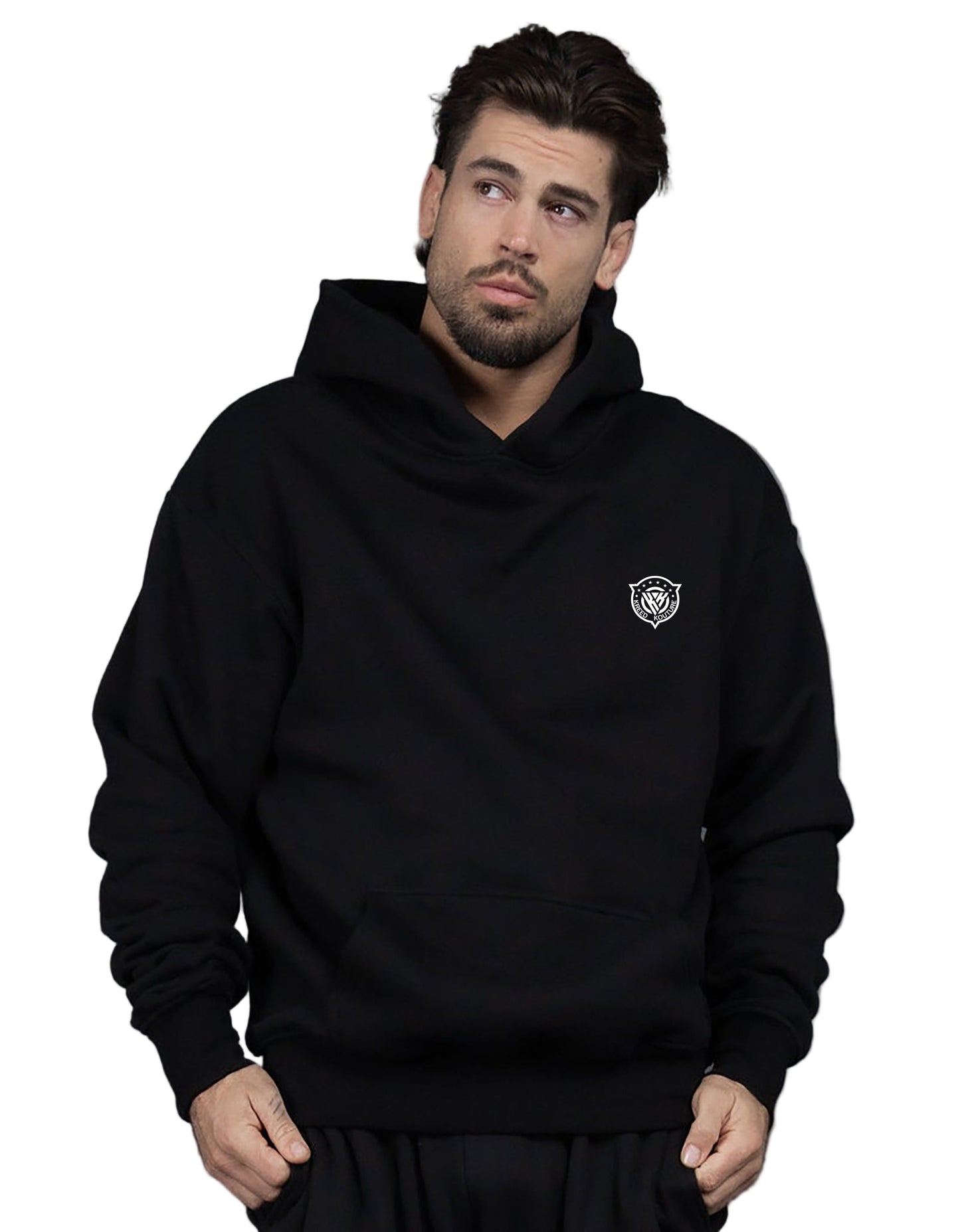 Man wearing a black hoodie with a logo on a gray background