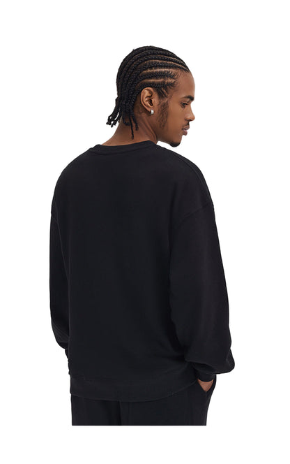 Person wearing a black sweatshirt on a white background