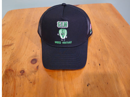 Black cap with green text and logo on a wooden surface