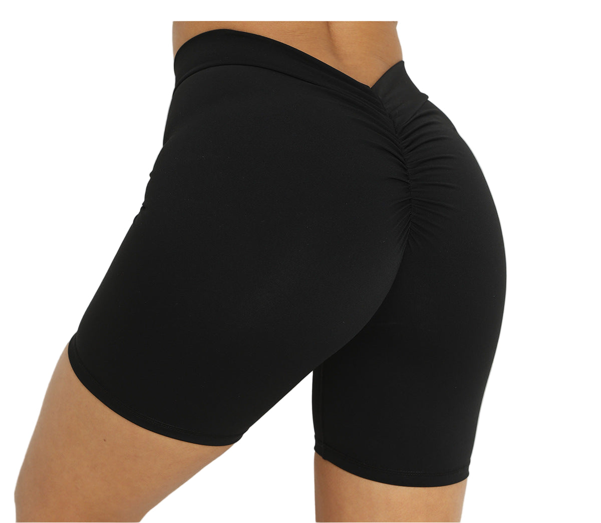 Black athletic shorts worn by a person on a light background