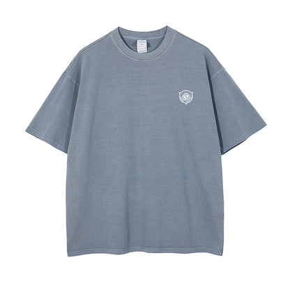 Blue t-shirt with a small logo on a white background