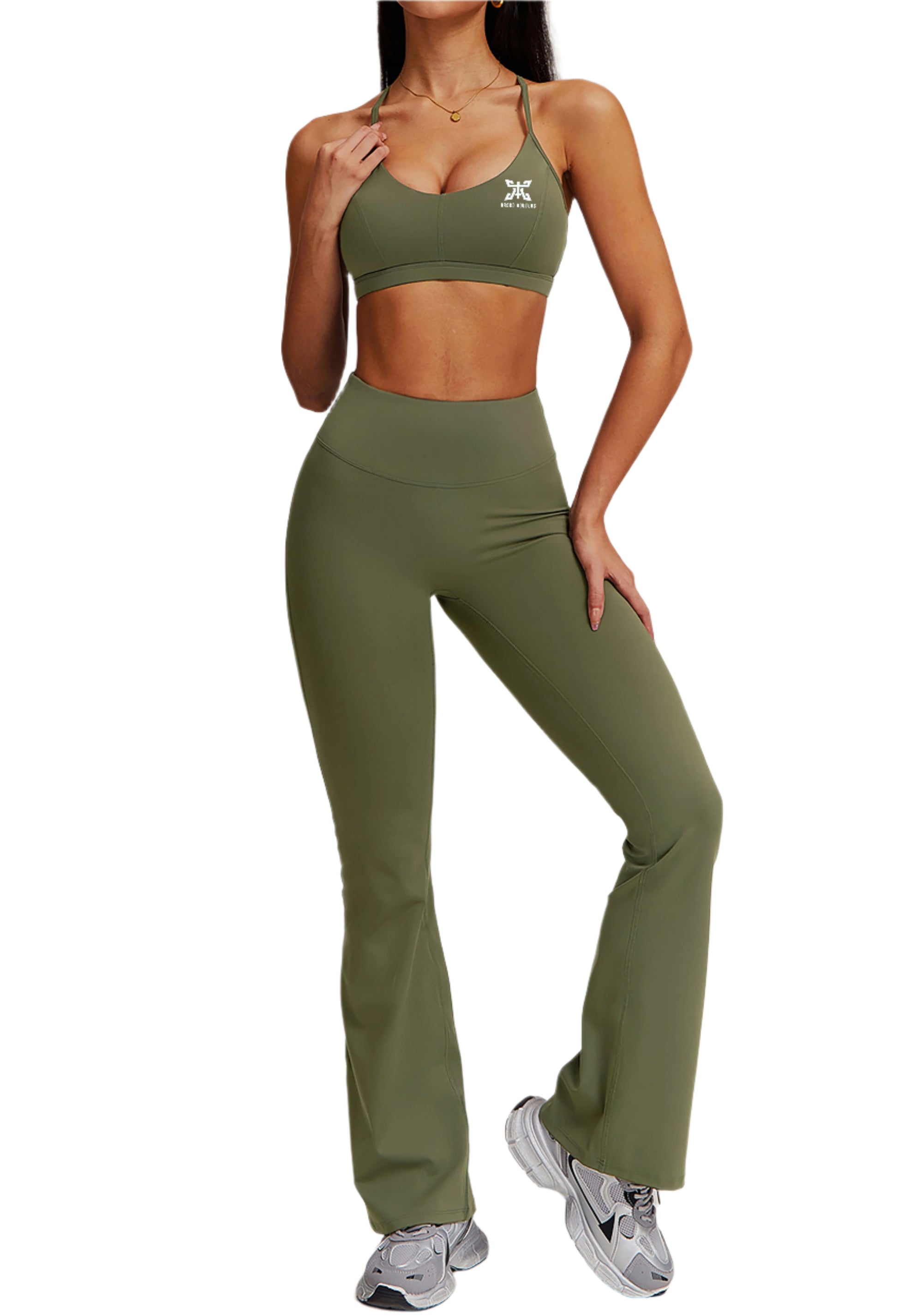 Person wearing green athletic outfit with a logo on a plain background