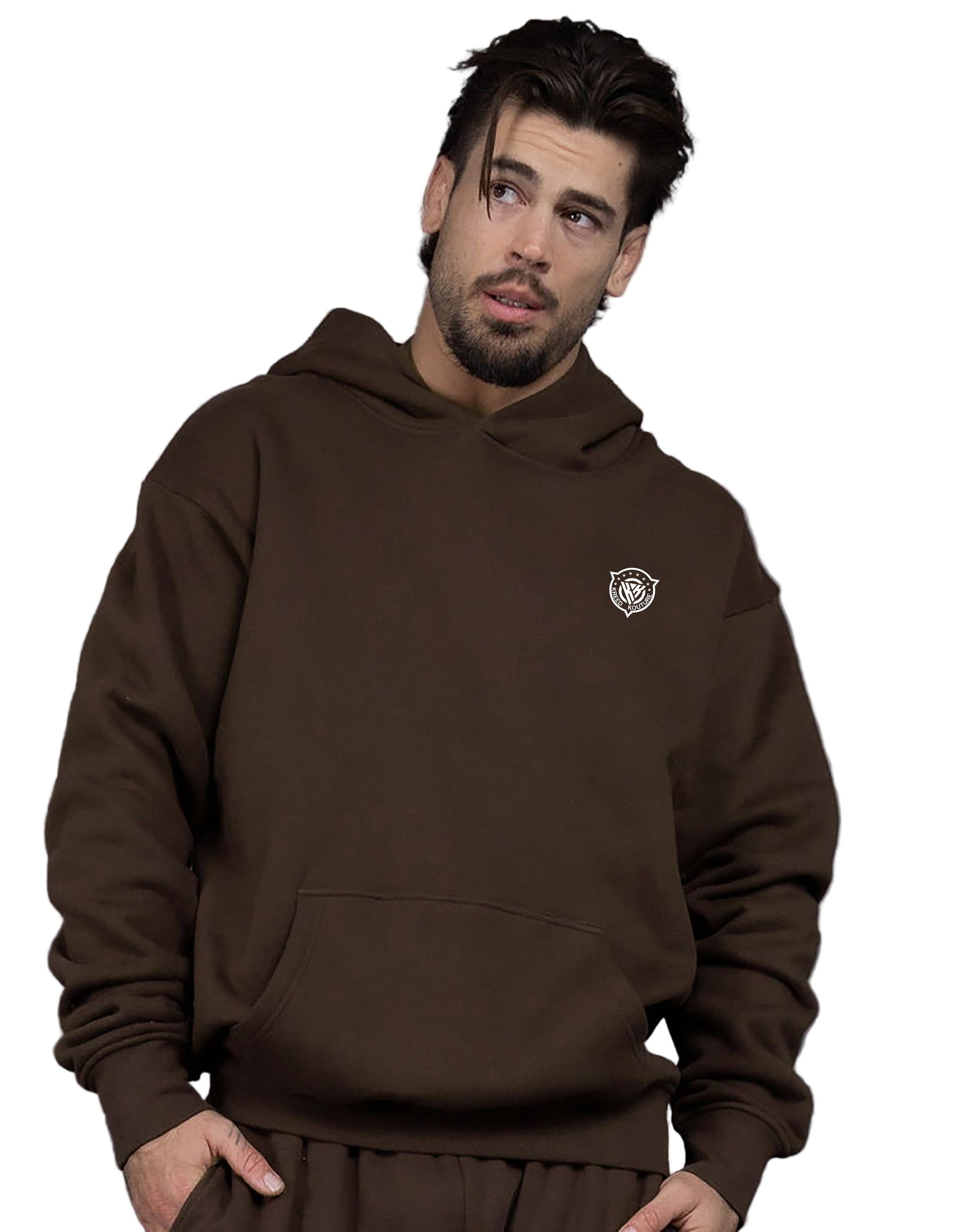 Man wearing a brown hoodie with a logo on a gray background