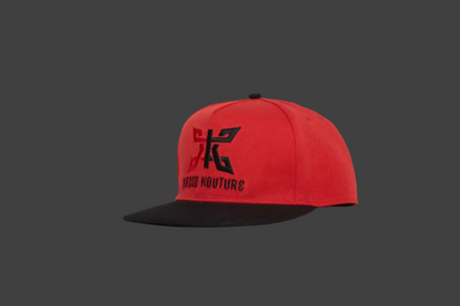 Red cap with black logo and text on a gray background