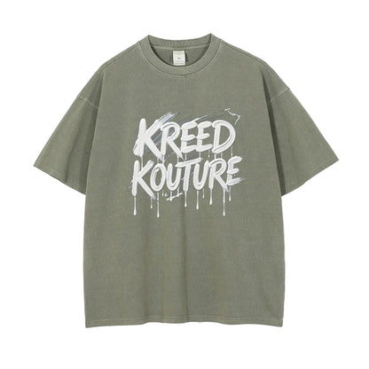 Green t-shirt with 'KREED KOUTURE' text on a white background