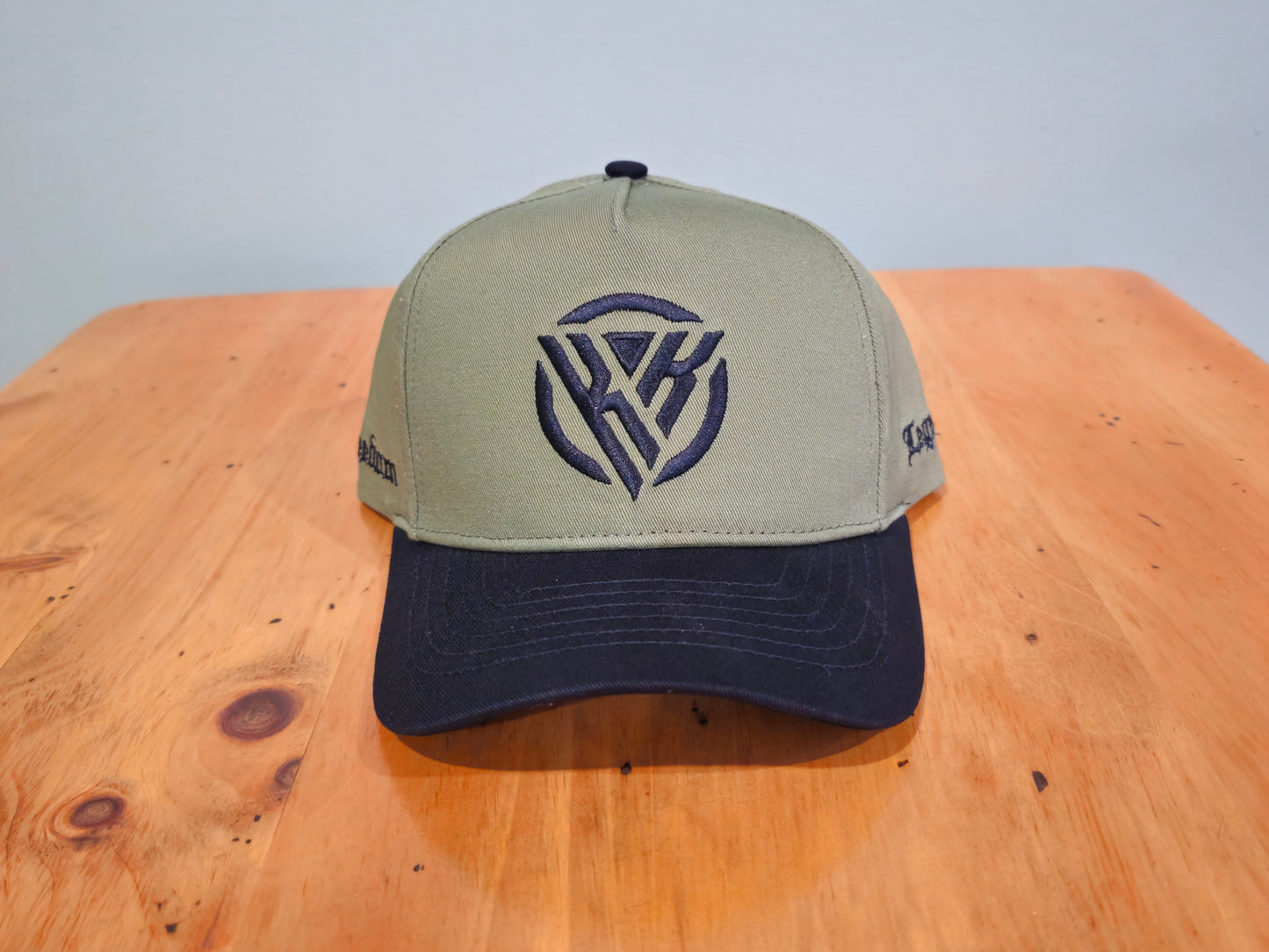 Cap with a logo on a wooden surface