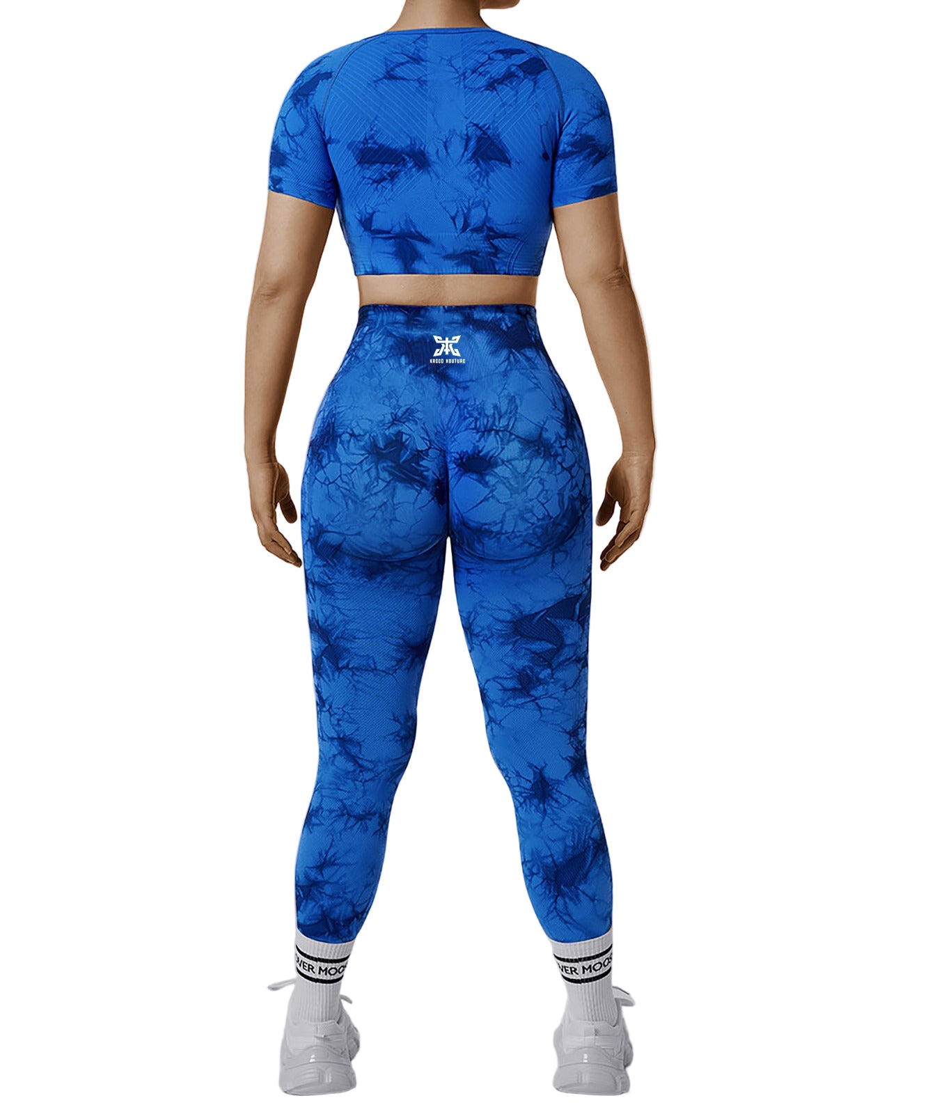 Person wearing a blue tie-dye athletic outfit on a white background