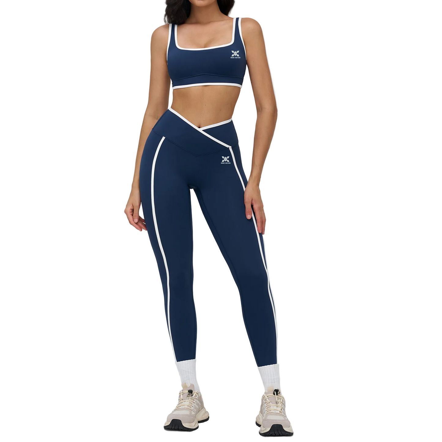 Navy blue athletic outfit with white accents on a plain background