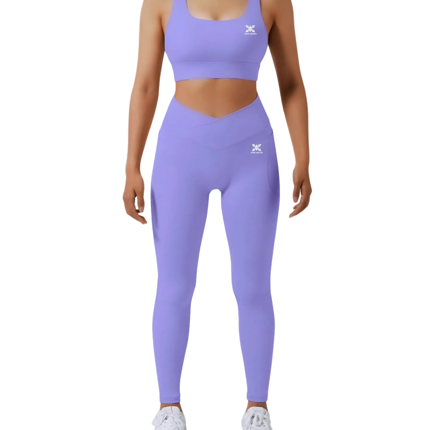 Person wearing a purple athletic outfit with a logo on a light gray background