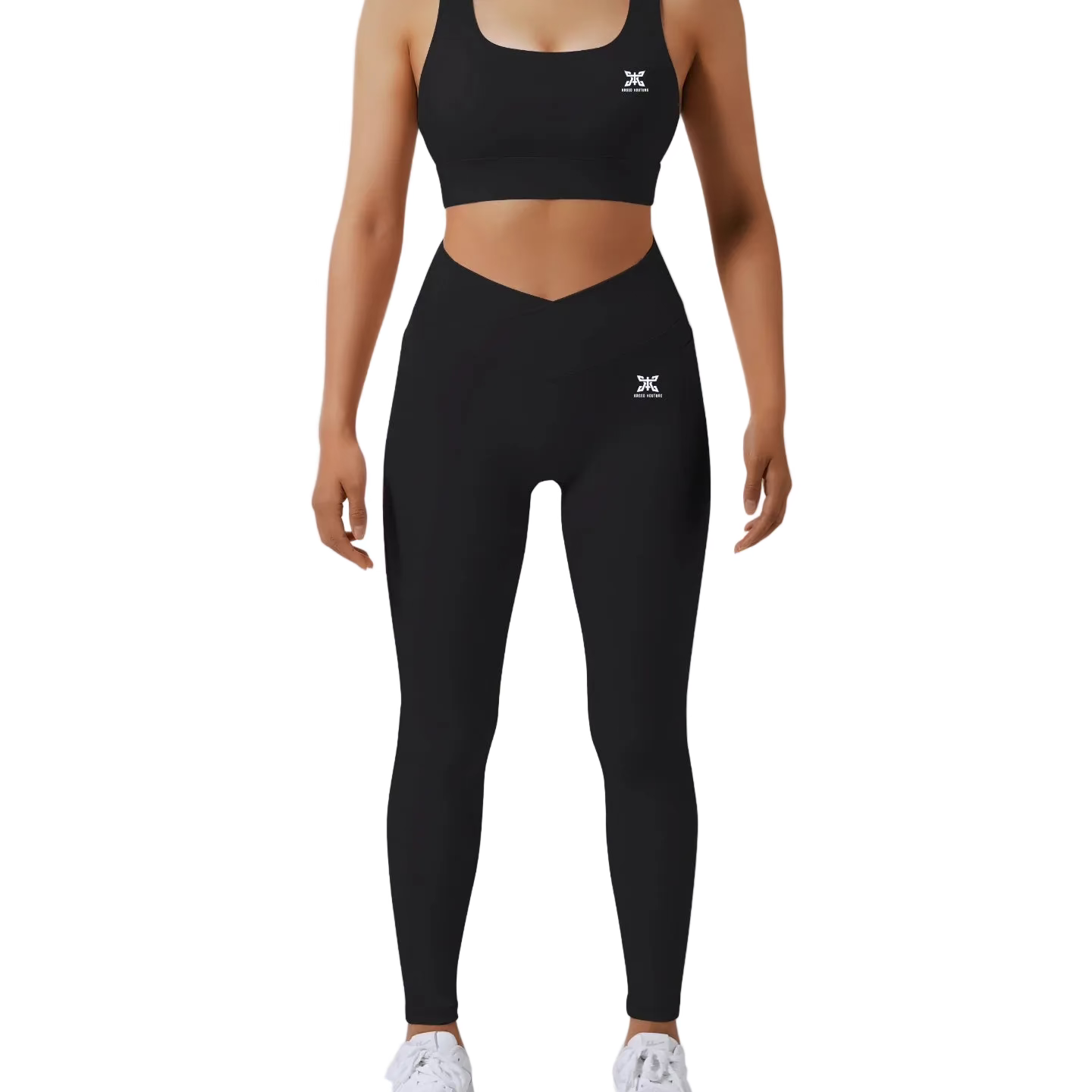 Person wearing black sports bra and leggings with a logo on a light gray background