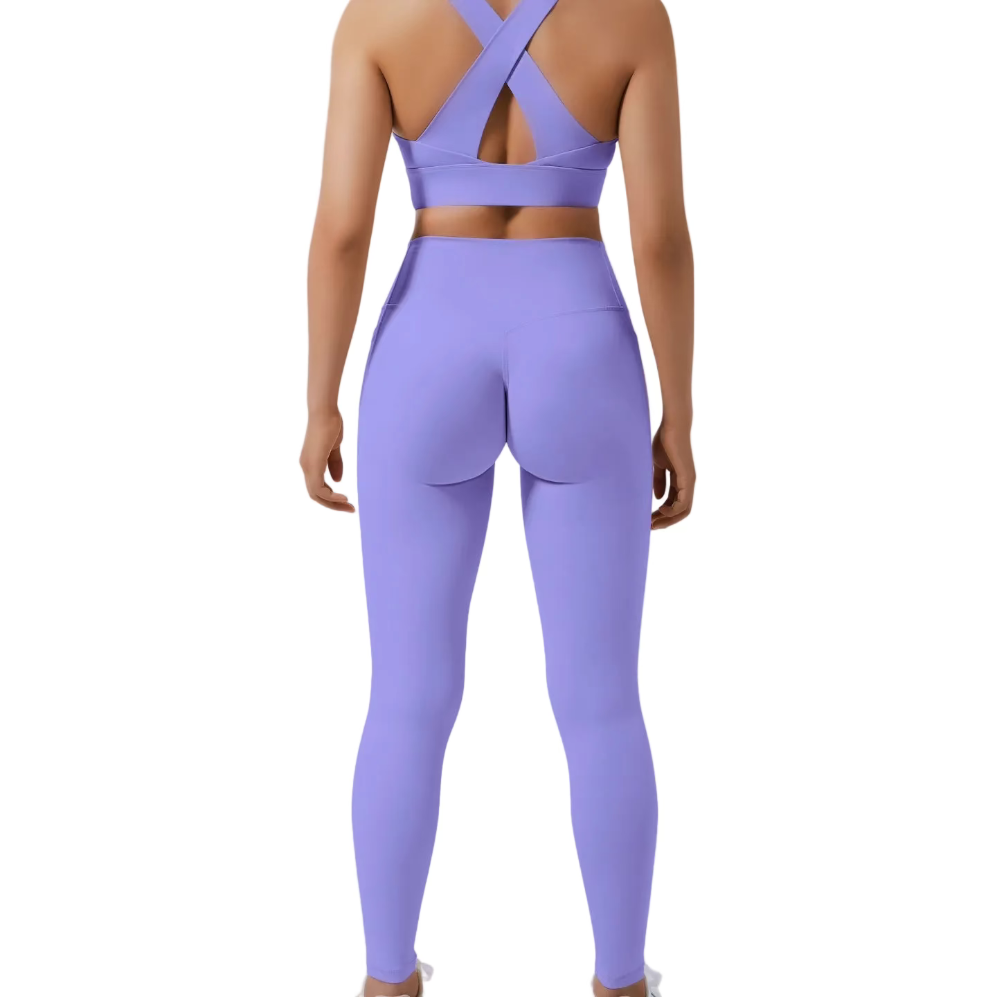 Person wearing a purple sports bra and leggings on a light gray background