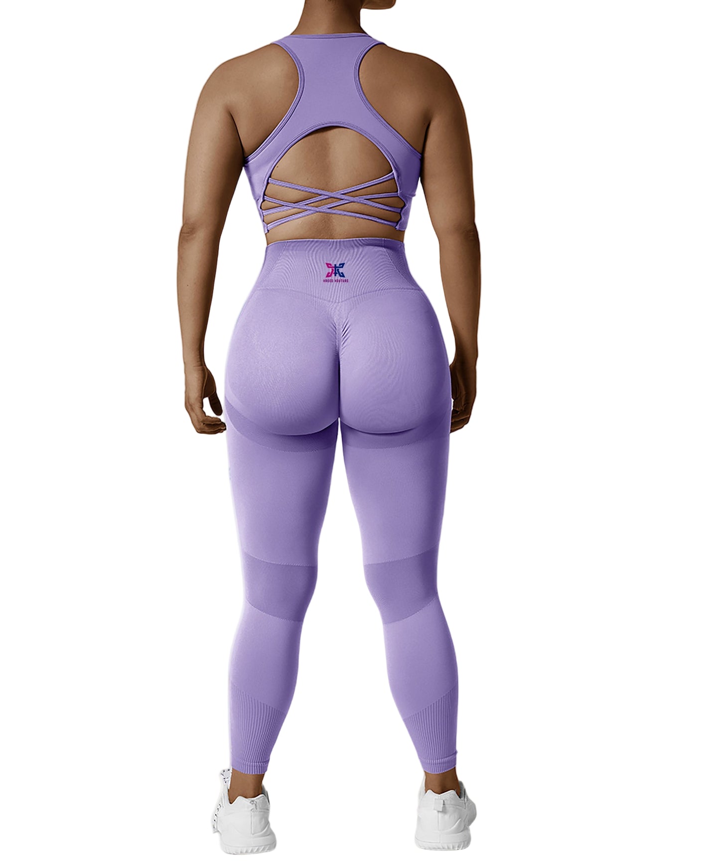 Person wearing a purple athletic outfit with a logo on a white background