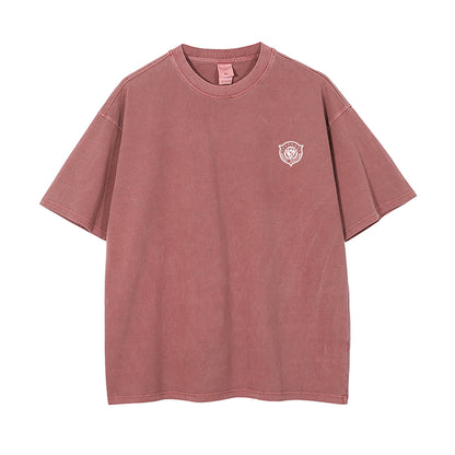 Pink t-shirt with a small logo on a white background