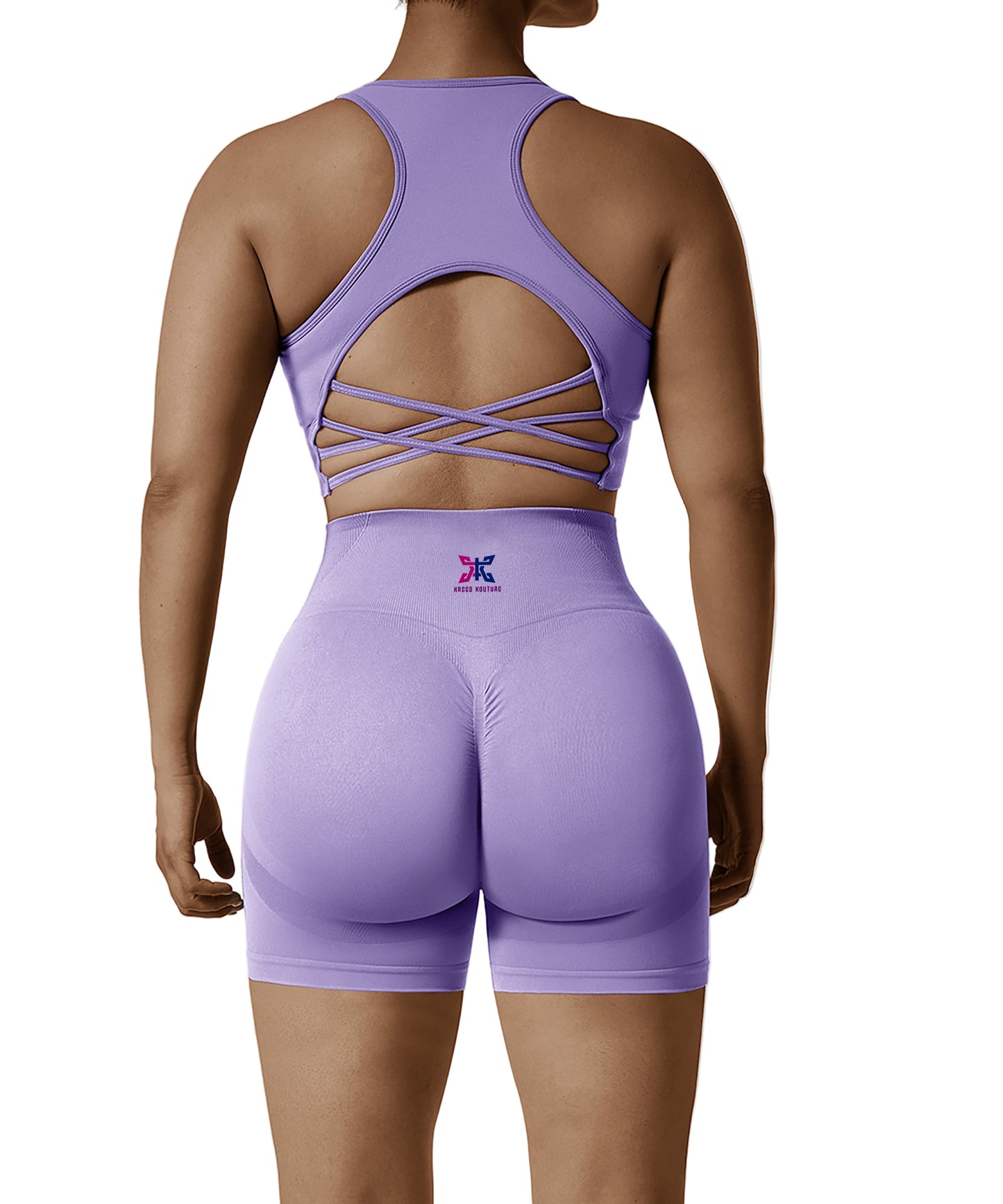 Purple athletic outfit with open back design on a plain background