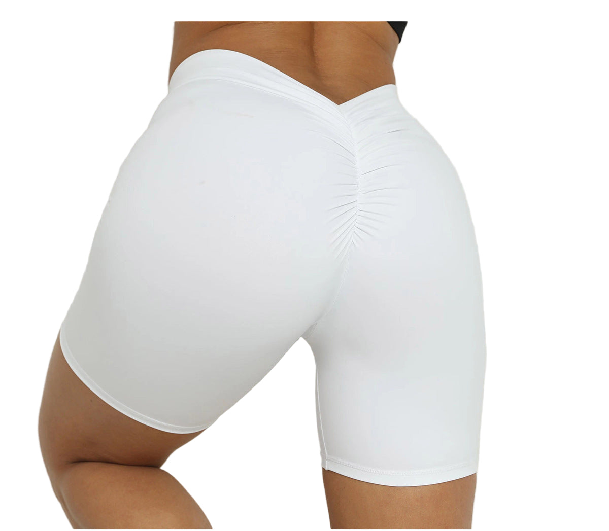 White athletic shorts worn by a person on a light background