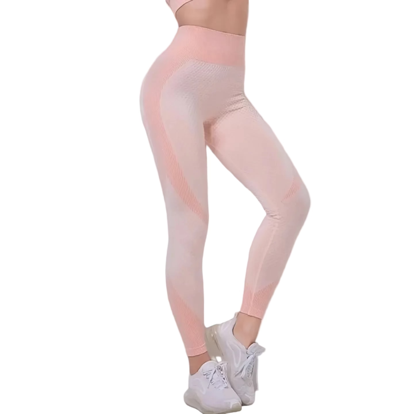 Person wearing light pink leggings and white sneakers on a plain background