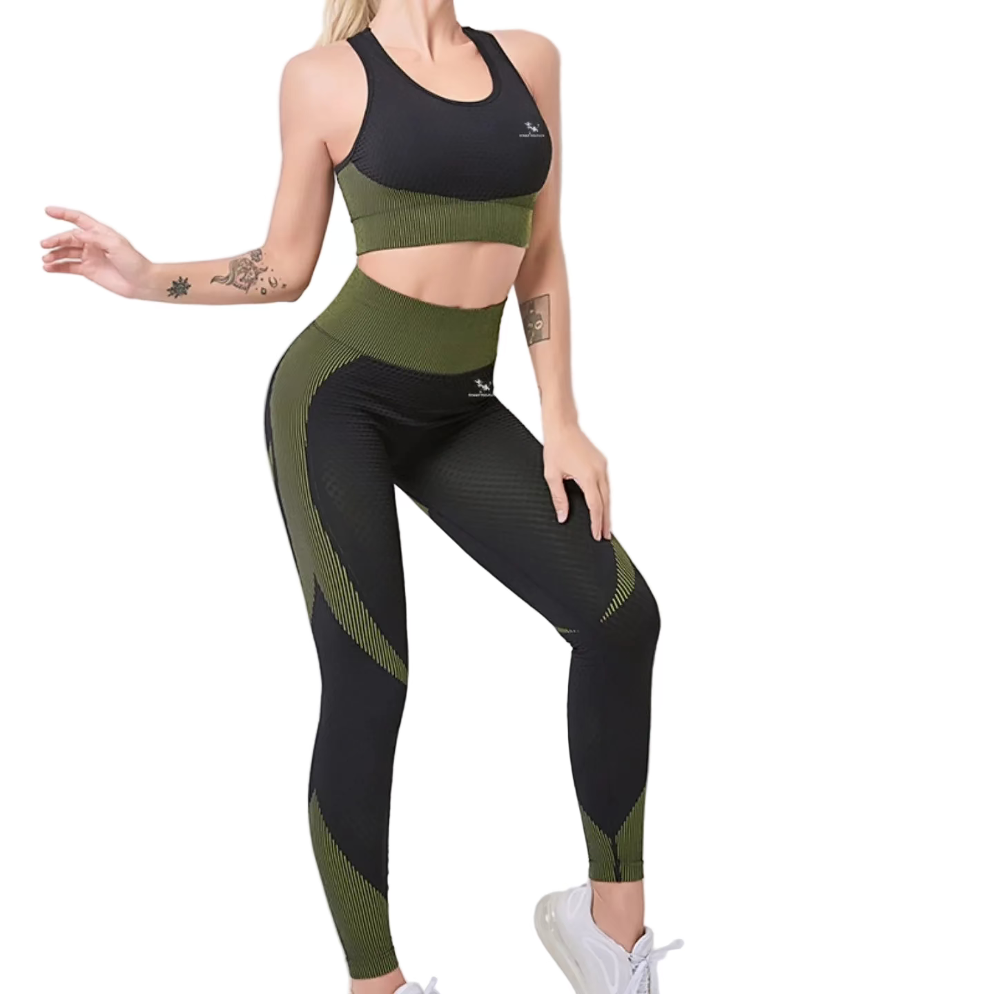 Woman wearing a black and green athletic outfit on a white background