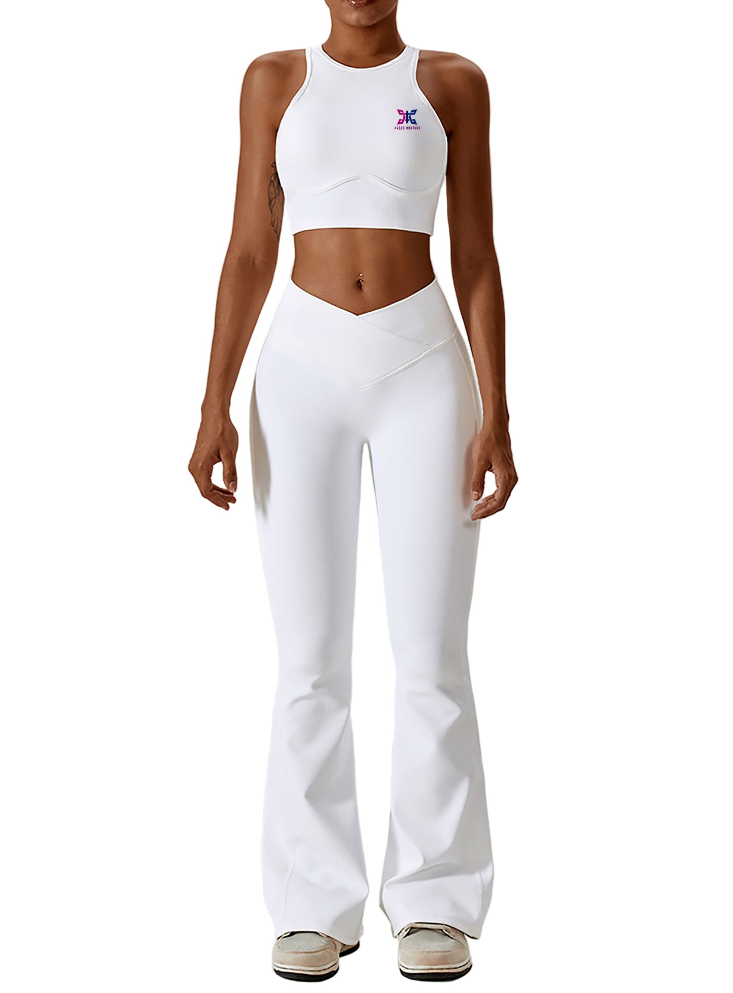 Person wearing a white athletic outfit with a logo on a plain background