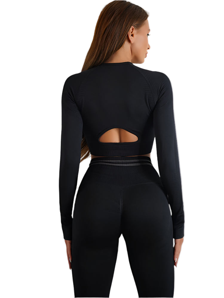 Black long-sleeve top with cutout design and matching leggings on a white background