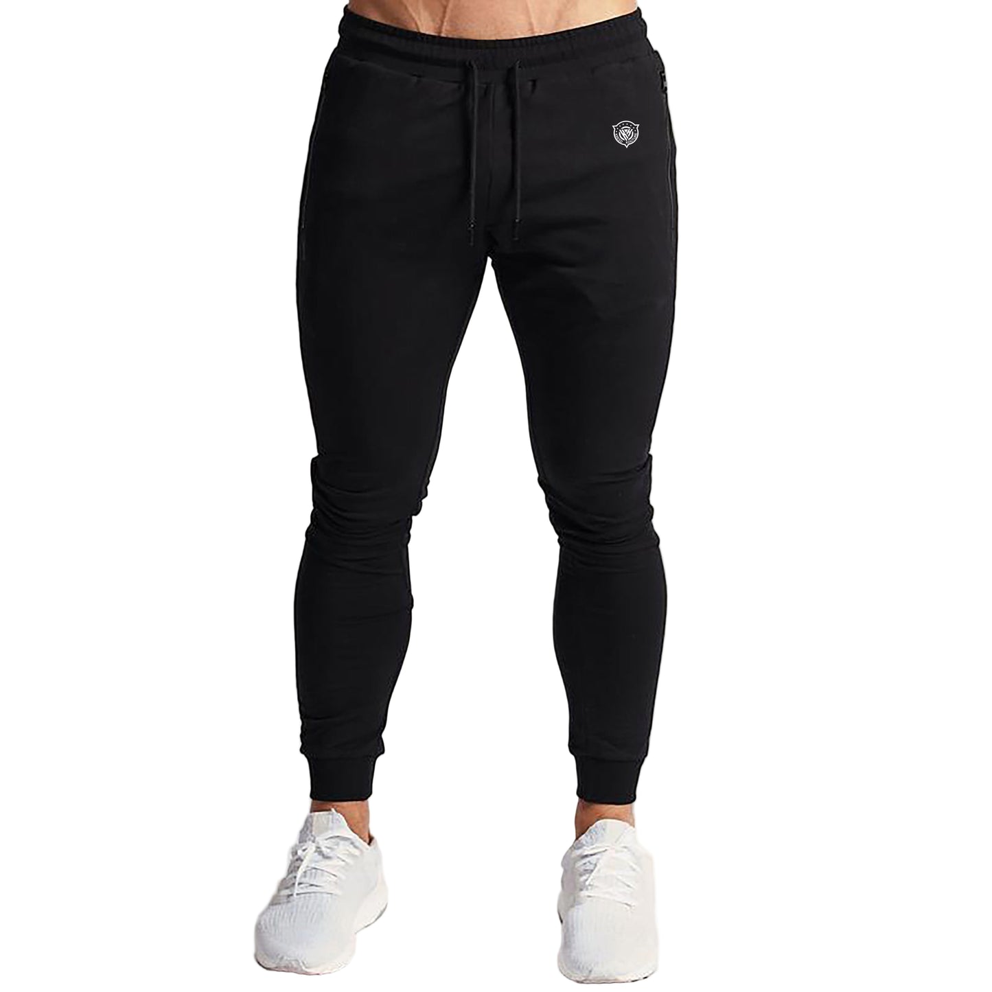 Person wearing black jogger pants with a brand logo on a white background
